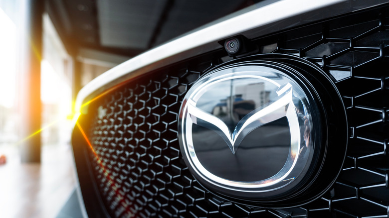 A close-up of modern Mazda logo