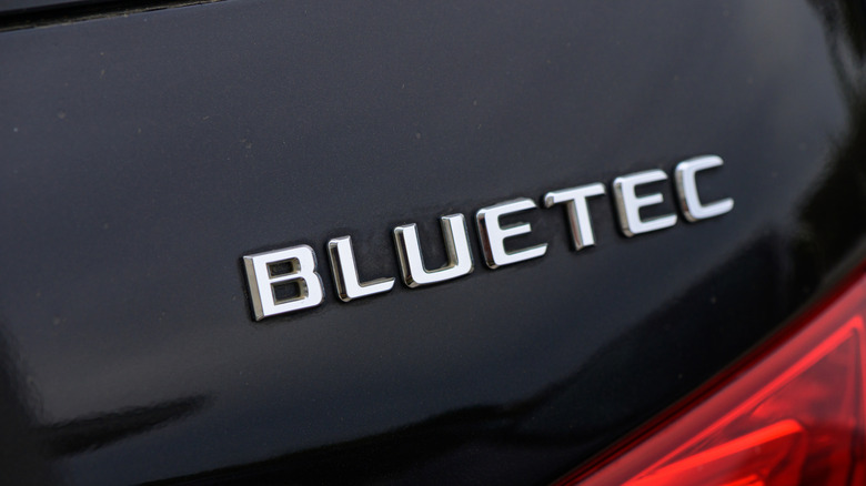 Mercedes Bluetec lettering on the back of a black car