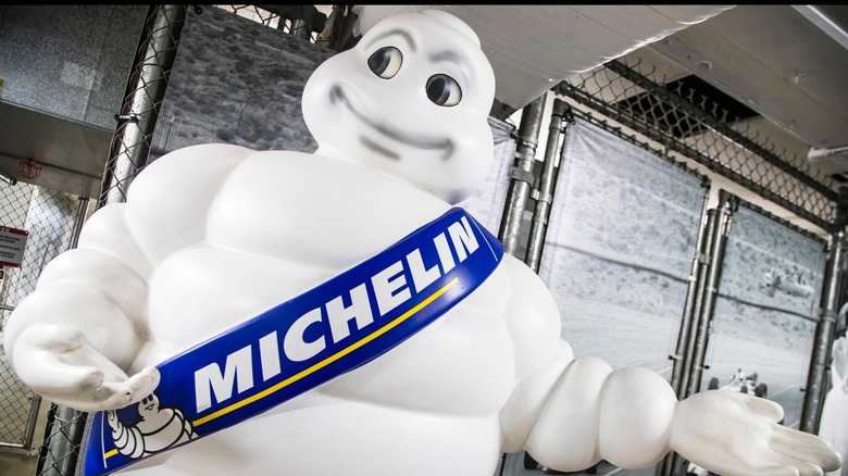 The Michelin man mascot in an industrial building