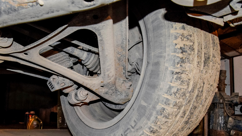 A multi-link rear suspension under a car