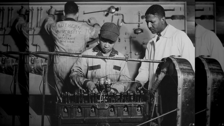 A tutor watches a student working on an engine at Southern University in Baton Rouge, Louisiana, circa 1943