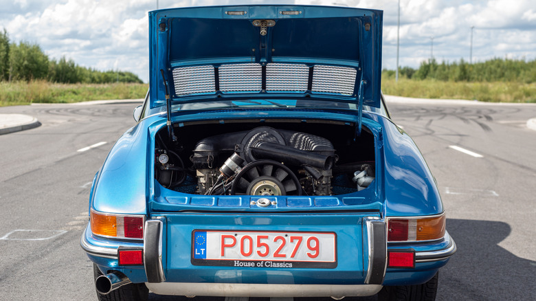 Blue Porsche 911 Targa with its rear-mounted engine visible