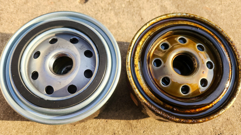 Comparing a new oil filter on the left with a used oil filter on the right