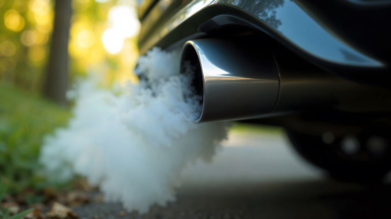 White smoke from a vehicle exhaust pipe