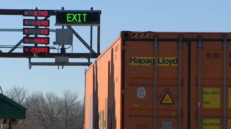 A Minnesota weigh station with truck traveling over the scale