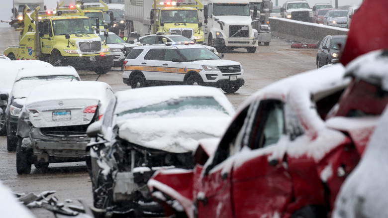 A multicar pileup on a highway during a winter storm.