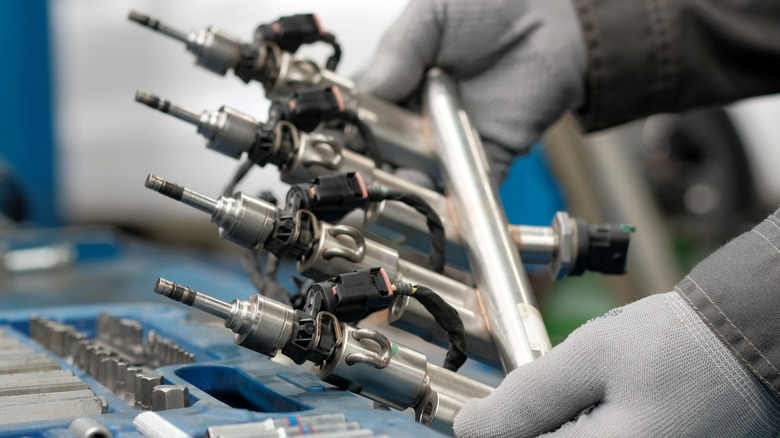 An image of a Ford F-150 next to an EcoBoost engine