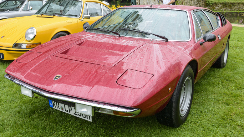 A Lamborghini Urraco parked on grass