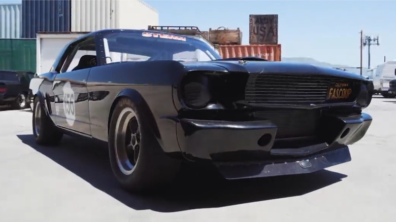 A 1965 Ford Mustang parked outside