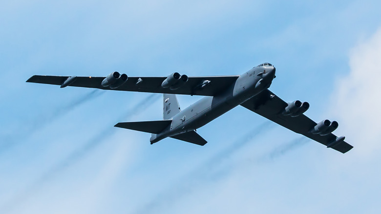 A B-52 bomber in the blue sky over Schönefeld Airport in Brandenburg, Germany.