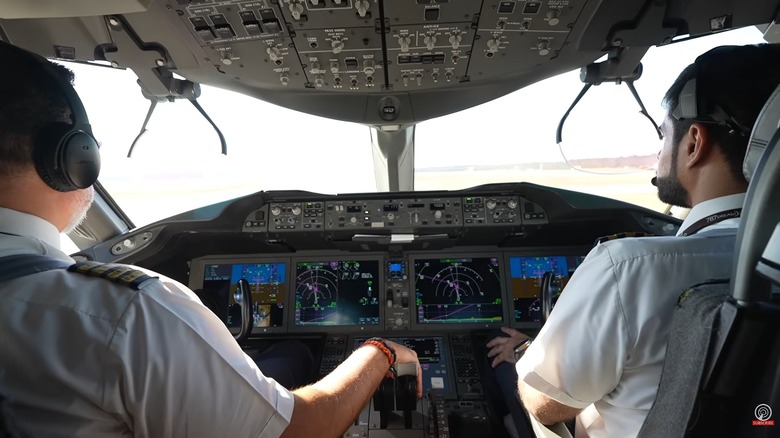 Two pilots taxiing on the runway in a 787