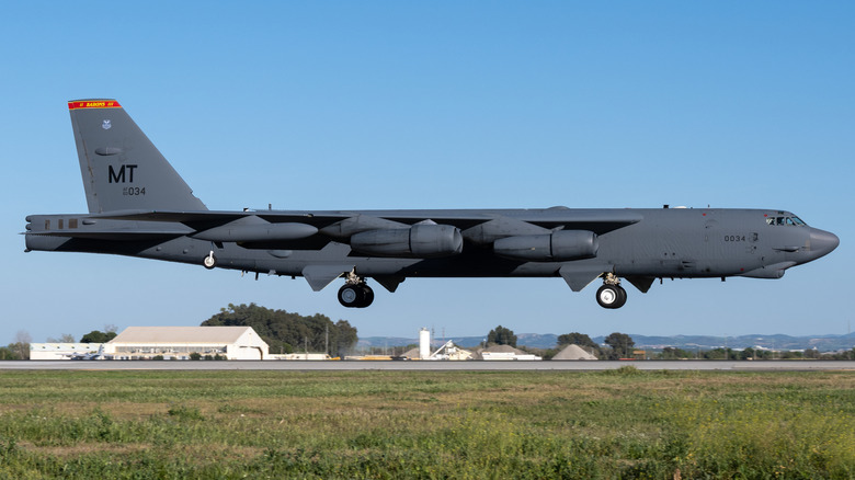 A military aircraft, B-52 bomber, in flight with landing gear down to Moron Air Base, Spain for Bomber Task Force Operations