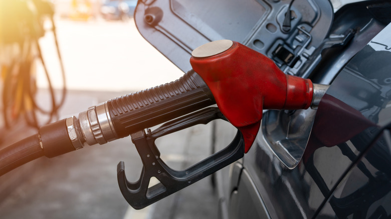 A car being refueled at a gas station