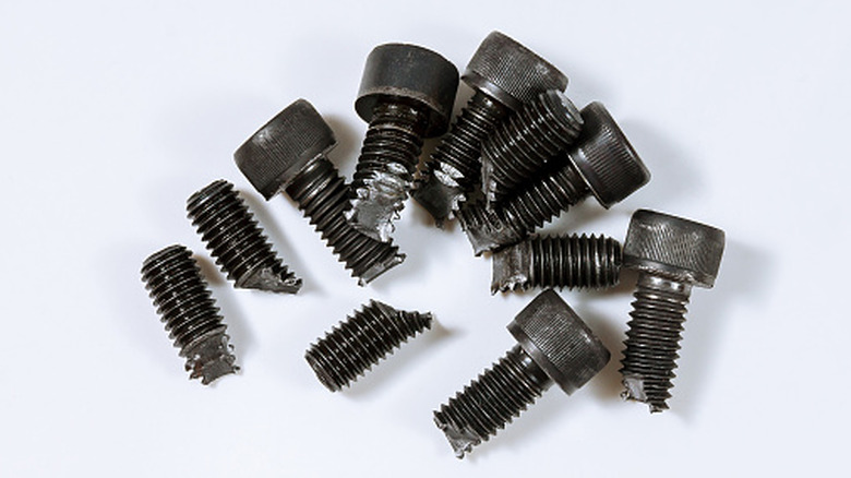 Broken bolts on white background