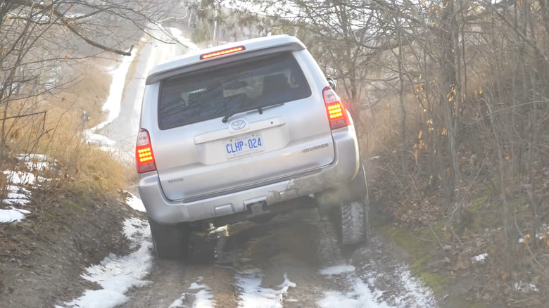 A fourth-generation Toyota V8 4Runner driving on an off-road trail