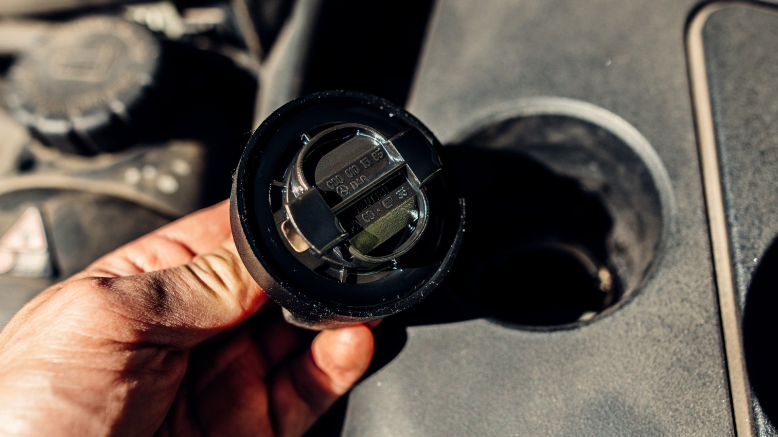 Why There Might Be White Sludge Under Your Oil Cap