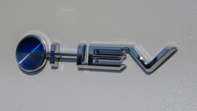 The bluish dot Beyond Zero and HEV badge connected a caller Toyota electrified vehicle