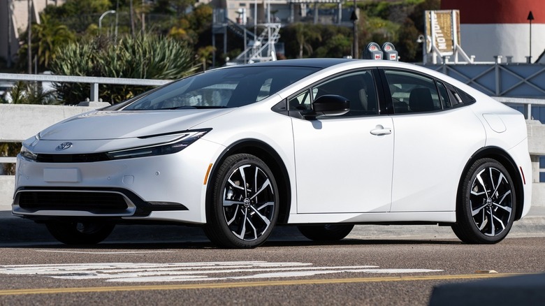 A 3/4 front shot of a Wind Chill Pearl 2024 Toyota Prius Prime
