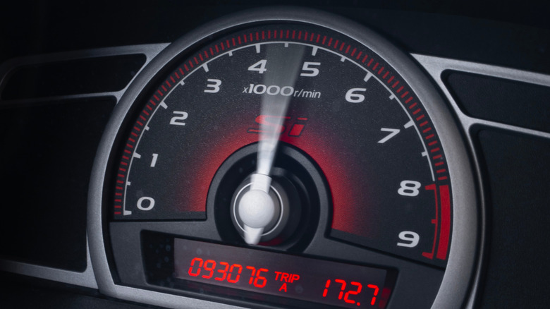 A car rev counter gauge showing high engine revolutions