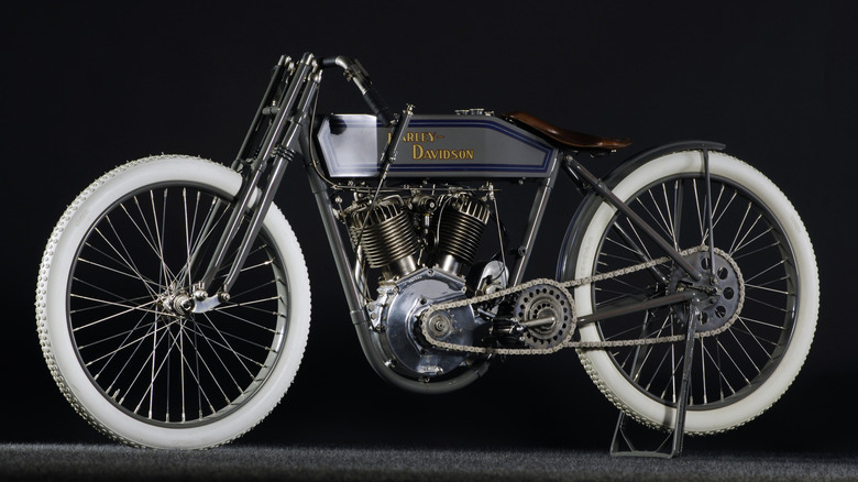A 1914 Harley-Davidson racing motorcycle against a black background