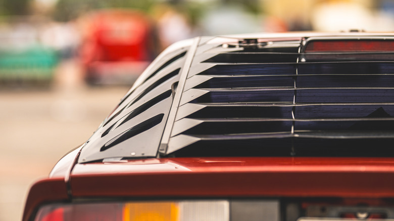 Window louvers on the rear hatch glass of a third generation Chevrolet Camaro.