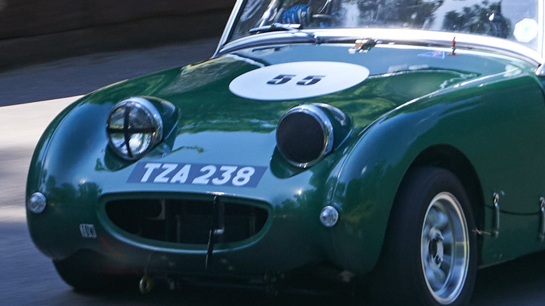 A Bugeye Sprite with one headlamp taped and the other covered.