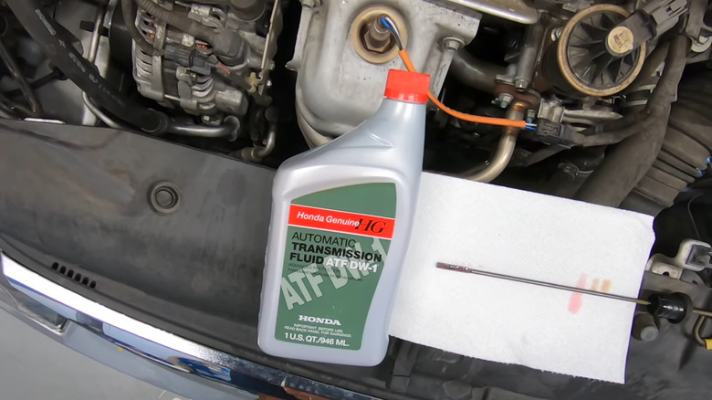 Genuine Honda automatic transmission fluid on a car.