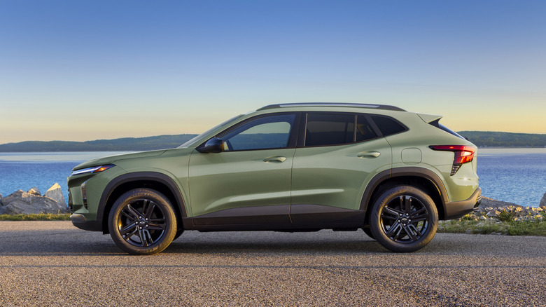A second-generation pre-production Chevrolet Trax ACTIV in Cacti Green parked on a road in front of a lake.