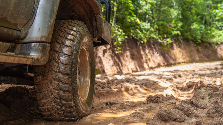 A close-up shot of a 4X4 tire on a dirt road