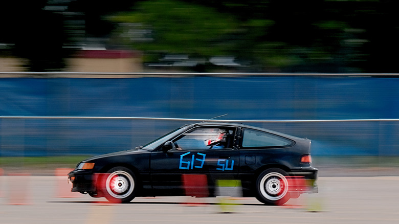 An arty shot of a Honda buzzing around an autocross course.
