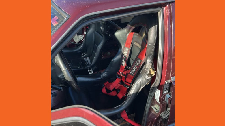 Interior of the Volvo, with racing seats and harnesses