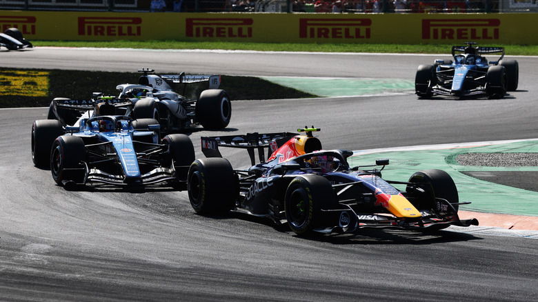Liam Lawson of New. Zealand driving the (30) Oracle Red Bull Racing RB22 Red Bull Ford Powertrains leads Carlos Sainz of Spain driving the (55) Williams FW48 Mercedes and Sergio Perez of Mexico driving the (11) Cadillac F1 Team MAC-26 Ferrari on track during the F1 Grand Prix of Italy at Autodromo Nazionale Monza on September 06, 2026 in Monza, Italy.
