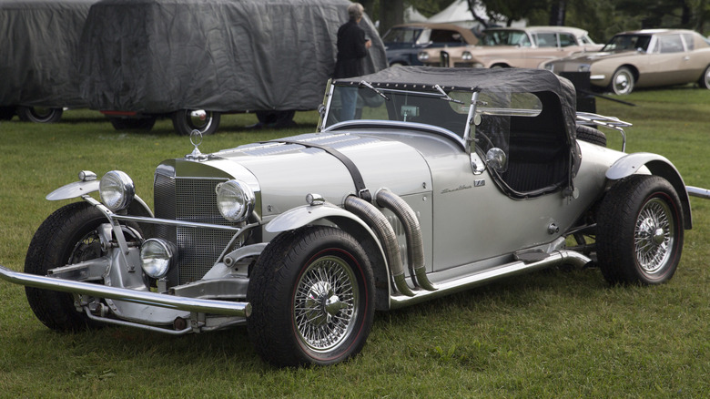 A sliver Excalibur Series I SS Roadster on display