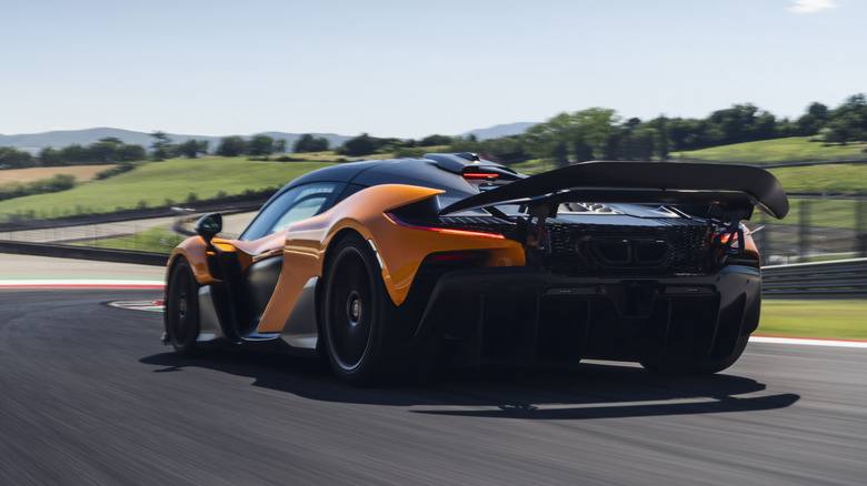 Rear 3/4 view of an orange McLaren W1 at Mugello.