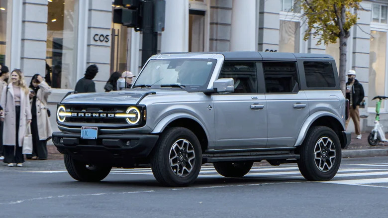 A gray Ford Bronco on a city street