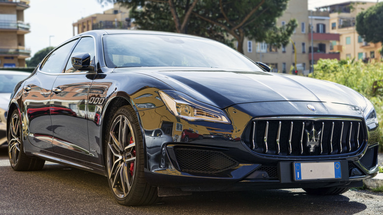 A parked blue Maserati Quattroporte