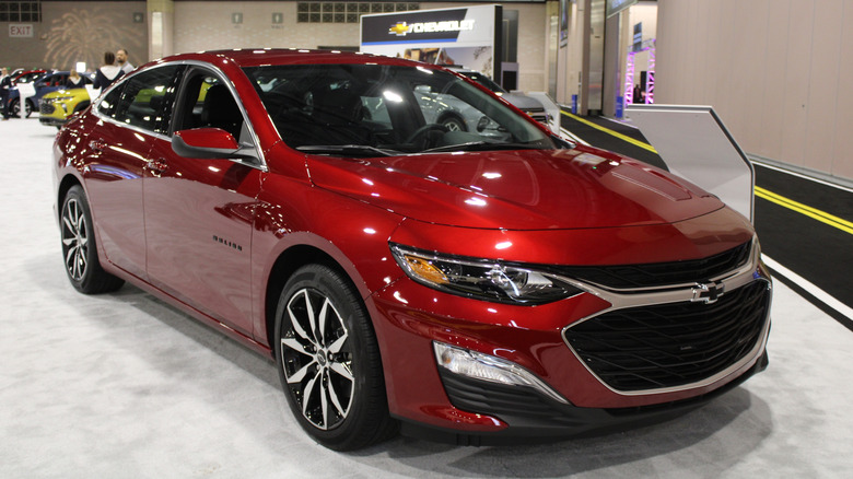 A front 3/4 of a red 2016 Chevrolet Malibu Hybrid
