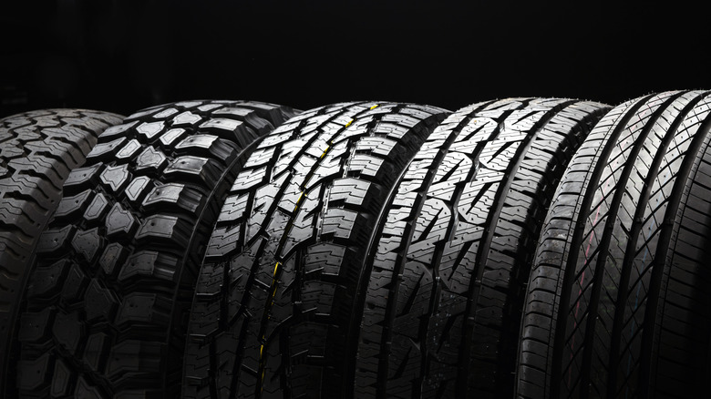 A row of different tire types against a black background