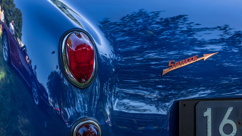 The rear badge of a blue Austin Healey Sprite
