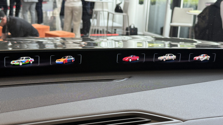 2027 BMW iX5 with Art Cars displayed on the Panoramic Vision display