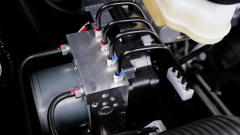 The heart of a car's ABS system, its actuator, with lines running to and from it.