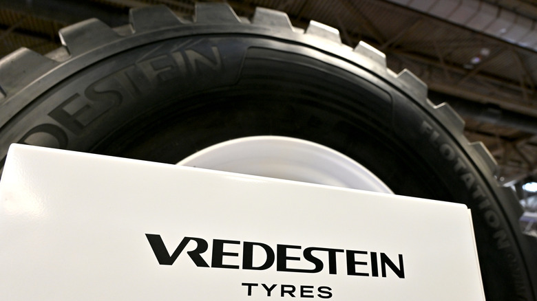 Vredestein logo next to a huge wheel and tire