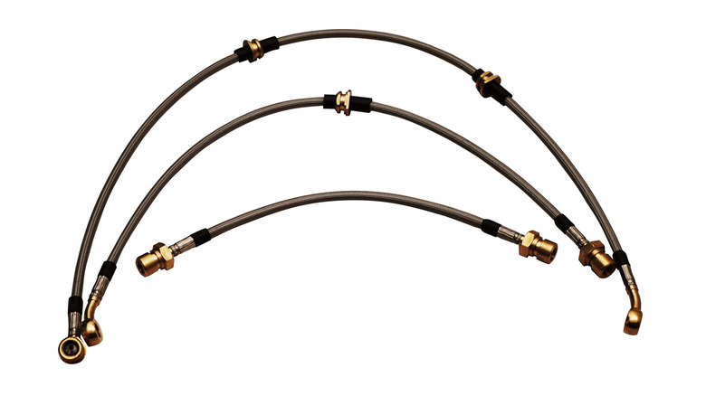 Stainless steel brake lines on a white background