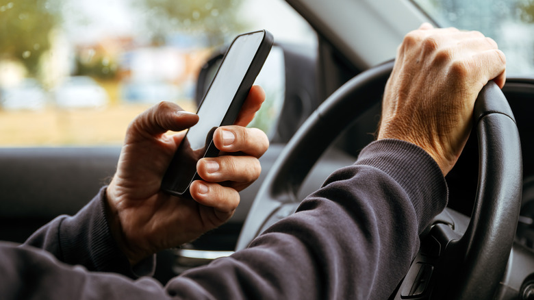 Man texting while driving