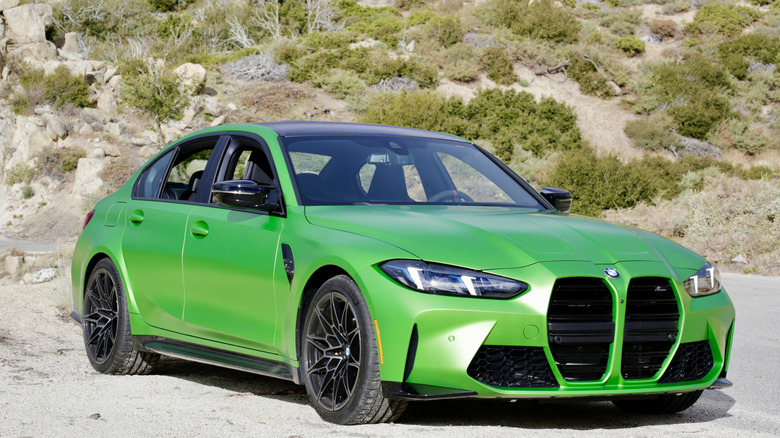 A bright green 2025 BMW M3 Competition equipped with the ZF 8HP automatic transmission.