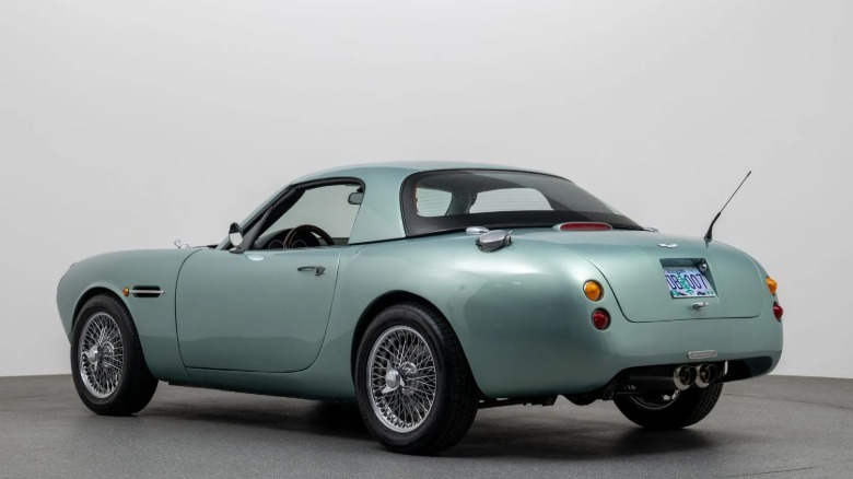 A rear three-quarters shot of the Miata with the Aston body in a studio