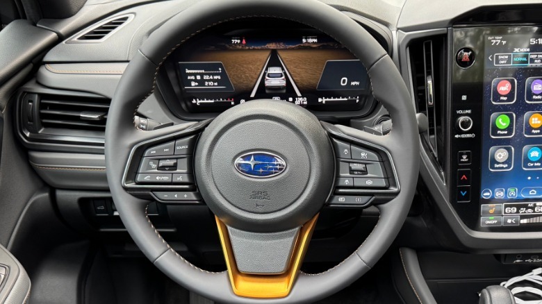 A close-up of the steering wheel and digital gauges in the new Forester Wilderness with the ADAS gauge display visible