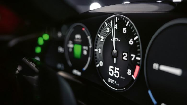 A close-up shot of the Taycan's new digital tachometer in a GTS model car