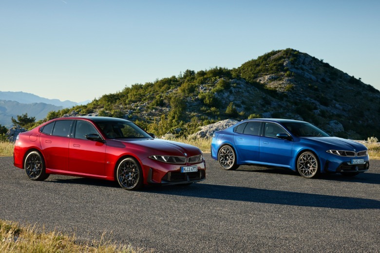 A red BMW 3 Series next to a blue BMW i3