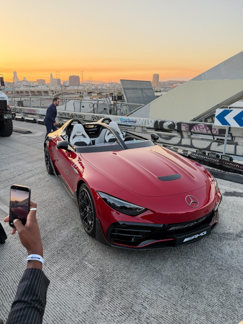 Front 3/4 view of a red AMG Purespeed on 6th Street Bridge